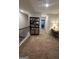 Upstairs hallway with desk, bookcase, and carpet flooring at 233 Ivey Ter # 39, Temple, GA 30179