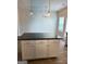Kitchen island with barstool seating and pendant lighting at 233 Ivey Ter # 39, Temple, GA 30179