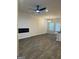 Living room with a ceiling fan, fireplace, and luxury vinyl floors at 233 Ivey Ter # 39, Temple, GA 30179