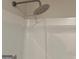 Modern shower head in a minimalist space, highlighting the clean lines and contemporary fixtures of the bathroom at 233 Ivey Ter # 39, Temple, GA 30179