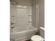 Standard white tub and shower combination unit in a neutral-toned bathroom at 233 Ivey Ter # 39, Temple, GA 30179