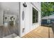 Balcony with a view of modern interior kitchen, showcasing the seamless indoor-outdoor living at 2443 Sycamore Nw Rd, Atlanta, GA 30318