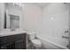 Well-lit bathroom with vanity, modern fixtures, toilet, and shower-tub combo at 2443 Sycamore Nw Rd, Atlanta, GA 30318
