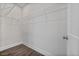 Bright walk-in closet with wire shelving and wood-look flooring at 2443 Sycamore Nw Rd, Atlanta, GA 30318