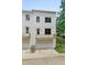 Modern townhome featuring clean white exteriors, garage and a small balcony at 2443 Sycamore Nw Rd, Atlanta, GA 30318