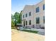 Charming two-story home with a white brick facade and well-manicured landscaping at 2443 Sycamore Nw Rd, Atlanta, GA 30318