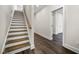 Inviting hallway featuring stairs with wood treads and modern flooring at 2443 Sycamore Nw Rd, Atlanta, GA 30318