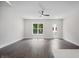 Bright open-concept living room with hardwood floors and large windows at 2443 Sycamore Nw Rd, Atlanta, GA 30318