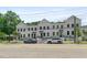 Street view of modern townhomes featuring clean white exteriors at 2443 Sycamore Nw Rd, Atlanta, GA 30318