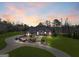 This luxury home features a paved driveway leading to a meticulously landscaped circular entrance at 1198 Elliot Rd, Mcdonough, GA 30252