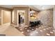 Basement space featuring a wet bar with brick accent wall and seating at 1198 Elliot Rd, Mcdonough, GA 30252