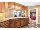 Finished basement featuring a bar area with granite countertops and decorative lighting at 1198 Elliot Rd, Mcdonough, GA 30252