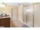 Bathroom featuring a granite countertop vanity, wood cabinets and a glass-door shower at 1198 Elliot Rd, Mcdonough, GA 30252