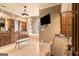 Bright bathroom featuring a large vanity with granite counters, a tub and a mounted television at 1198 Elliot Rd, Mcdonough, GA 30252