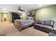Cozy bedroom with a ceiling fan, stylish desk and a loveseat couch at 1198 Elliot Rd, Mcdonough, GA 30252