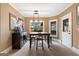 Dining room featuring a wooden table, four stools, built in cabinet and plenty of natural light at 1198 Elliot Rd, Mcdonough, GA 30252