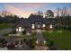 Stunning brick home with well-manicured lawn, landscape lighting and beautiful entryway at 1198 Elliot Rd, Mcdonough, GA 30252