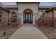 The property features an inviting entrance, highlighted by a custom door and manicured landscaping at 1198 Elliot Rd, Mcdonough, GA 30252