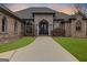 A beautiful brick house with meticulous landscaping, including a paved driveway and vibrant greenery at 1198 Elliot Rd, Mcdonough, GA 30252