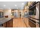 Gourmet kitchen boasts modern stainless steel appliances and light colored cabinetry at 1198 Elliot Rd, Mcdonough, GA 30252