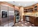 Kitchen features stainless steel appliances, custom cabinetry, and tile flooring for a modern, functional space at 1198 Elliot Rd, Mcdonough, GA 30252