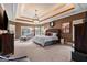 Spacious main bedroom featuring a tray ceiling, and large windows at 1198 Elliot Rd, Mcdonough, GA 30252