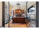 Home office boasts a large desk, built-in bookcase, and hardwood flooring at 1198 Elliot Rd, Mcdonough, GA 30252