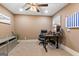 Comfortable home office with ceiling fan, large desk, and neutral paint at 1198 Elliot Rd, Mcdonough, GA 30252