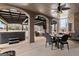 Spacious covered patio with hot tub, outdoor seating, and ceiling fan at 1198 Elliot Rd, Mcdonough, GA 30252