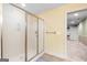 Bathroom featuring glass-door shower and cream color walls at 1198 Elliot Rd, Mcdonough, GA 30252