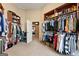 Spacious walk-in closet featuring lots of hanging space and shelving at 1198 Elliot Rd, Mcdonough, GA 30252