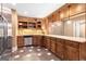 Elegant wet bar with ample counter space, custom cabinetry, and stainless steel appliances for entertaining at 1198 Elliot Rd, Mcdonough, GA 30252