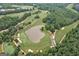 Stunning aerial view of the golf course, highlighting the lush greenery and serene water features at 5053 Chapel Xing, Douglasville, GA 30135