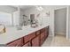 This bathroom features double sinks with granite countertops and wood cabinets at 88 Hardy Water Dr, Lawrenceville, GA 30045