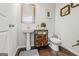Charming powder room featuring a pedestal sink, stylish fixtures, and neutral decor at 88 Hardy Water Dr, Lawrenceville, GA 30045