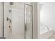 This bathroom features a glass shower and a soaking tub with chrome fixtures at 88 Hardy Water Dr, Lawrenceville, GA 30045