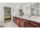 This primary bathroom features double sinks, a walk-in shower, and decorative shelving at 88 Hardy Water Dr, Lawrenceville, GA 30045