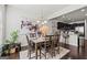 Elegant dining room with stylish table setting and view into the kitchen at 88 Hardy Water Dr, Lawrenceville, GA 30045