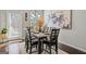 Bright dining area with a table for six and view of outdoor area at 88 Hardy Water Dr, Lawrenceville, GA 30045