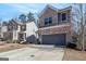 Charming two-story home with brick and siding exterior and a two-car garage at 88 Hardy Water Dr, Lawrenceville, GA 30045