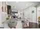 Bright eat-in kitchen features granite countertops, stainless steel appliances, and stylish pendant lighting at 88 Hardy Water Dr, Lawrenceville, GA 30045