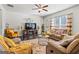 Cozy living room with comfortable seating, decorative rug, and plenty of natural light at 88 Hardy Water Dr, Lawrenceville, GA 30045