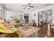 Spacious living room featuring hardwood floors and a view into the kitchen at 88 Hardy Water Dr, Lawrenceville, GA 30045