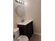 Modern bathroom featuring a round mirror, stylish vanity, and modern fixtures at 138 Plantation Cir, Clarkston, GA 30021