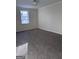 Spacious bedroom with carpet flooring and a bright window providing natural light at 138 Plantation Cir, Clarkston, GA 30021