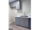 Updated kitchen showcasing light countertops, gray cabinets, and modern flooring at 138 Plantation Cir, Clarkston, GA 30021