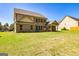 Exterior of home features a spacious backyard with lush green lawn perfect for outdoor activities and entertaining at 204 Shelton Dr, Mcdonough, GA 30252