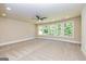 Large bedroom with carpet, ceiling fan and natural lighting at 204 Shelton Dr, Mcdonough, GA 30252
