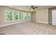 Bedroom featuring large windows and neutral carpet at 204 Shelton Dr, Mcdonough, GA 30252