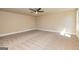 A large bedroom with neutral colored walls and carpet at 204 Shelton Dr, Mcdonough, GA 30252